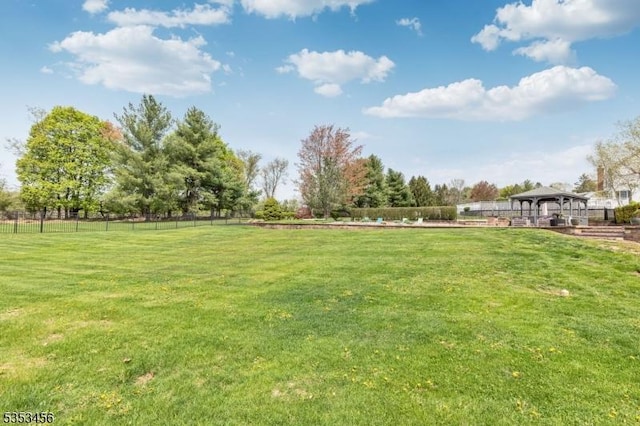 view of yard with a gazebo and fence
