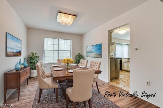dining area with light wood-type flooring