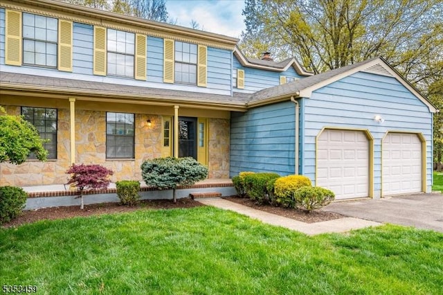 view of front of home with a front lawn, stone siding, a garage, aphalt driveway, and a chimney