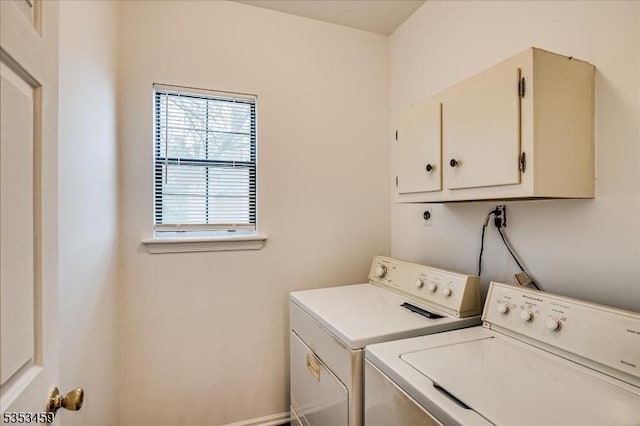 laundry room featuring cabinet space and washer and clothes dryer