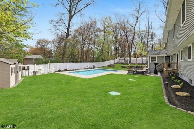 view of yard with a fenced in pool and a fenced backyard