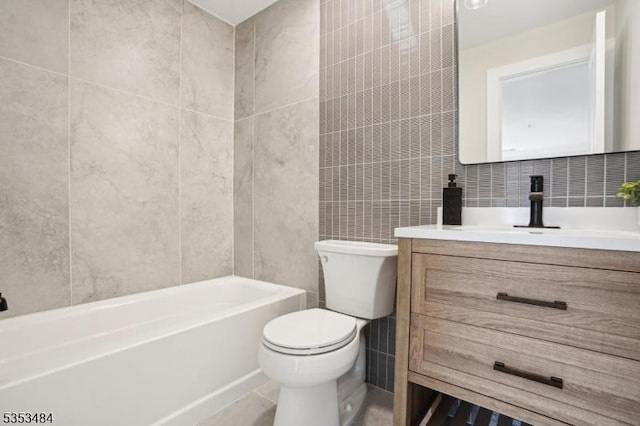 full bath featuring toilet, tile patterned floors, tile walls, and vanity