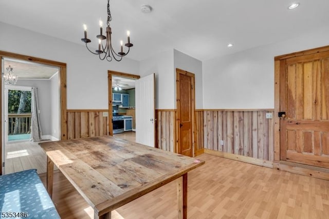97 Belvidere Ave, Oxford Twp, NJ 07863 - dining area with wood walls, a wainscoted wall, an inviting chandelier, recessed lighting, and wood finished floors