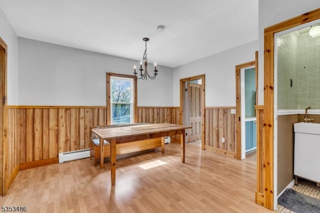 97 Belvidere Ave, Oxford Twp, NJ 07863 - dining space with a wainscoted wall, light wood-style floors, a chandelier, and a baseboard radiator
