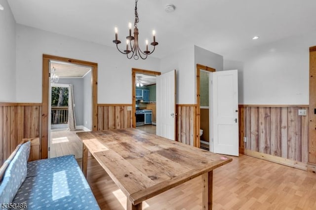 97 Belvidere Ave, Oxford Twp, NJ 07863 - dining space featuring a notable chandelier, wainscoting, and wood walls