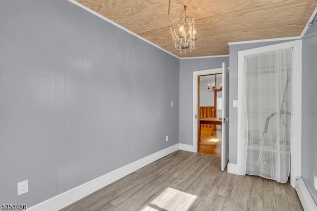 97 Belvidere Ave, Oxford Twp, NJ 07863 - unfurnished bedroom with ornamental molding, a notable chandelier, wood finished floors, and baseboards