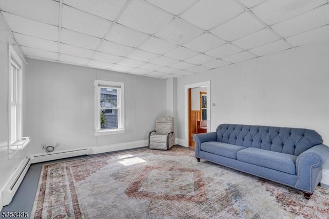 97 Belvidere Ave, Oxford Twp, NJ 07863 - living area featuring a baseboard radiator, a drop ceiling, and baseboards