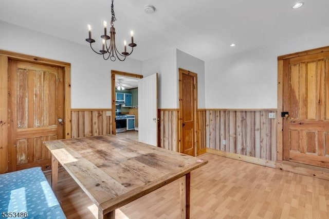 97 Belvidere Ave, Oxford Twp, NJ 07863 - dining area featuring recessed lighting, wood finished floors, wood walls, a wainscoted wall, and a notable chandelier
