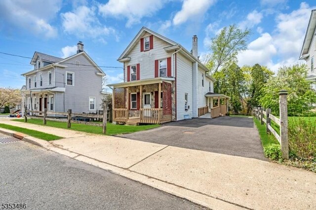 97 Belvidere Ave, Oxford Twp, NJ 07863 - view of front of property featuring a porch, fence, a chimney, and aphalt driveway