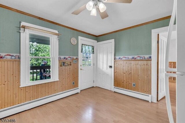 97 Belvidere Ave, Oxford Twp, NJ 07863 - foyer entrance with ornamental molding, ceiling fan, baseboard heating, and wood finished floors