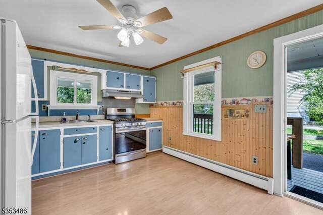 97 Belvidere Ave, Oxford Twp, NJ 07863 - kitchen with a sink, under cabinet range hood, stainless steel gas range oven, freestanding refrigerator, and a baseboard radiator