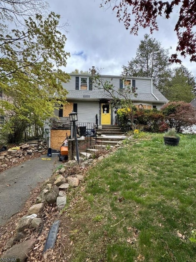 view of front of property featuring a chimney