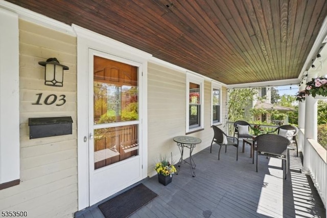 wooden deck featuring covered porch