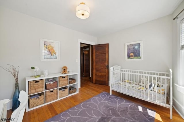 bedroom with wood finished floors