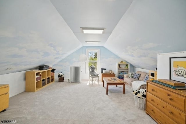 interior space featuring carpet, radiator heating unit, and vaulted ceiling