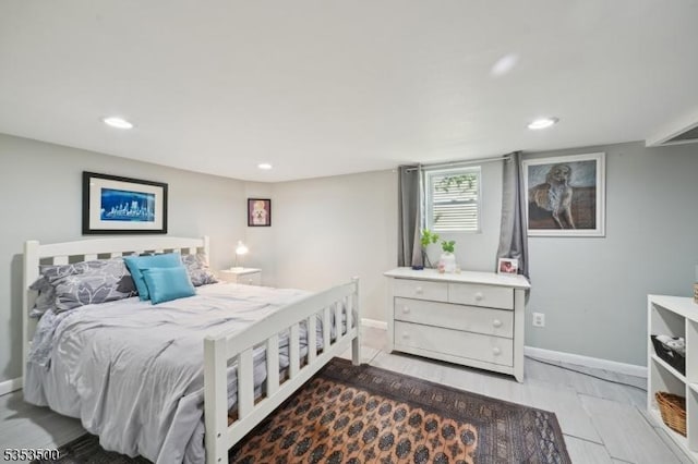 bedroom with recessed lighting and baseboards