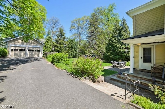 exterior space featuring an outbuilding and a garage