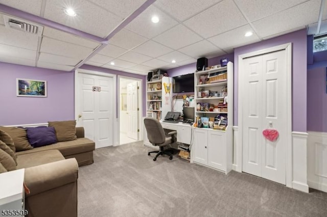 carpeted office space featuring visible vents, a paneled ceiling, and recessed lighting