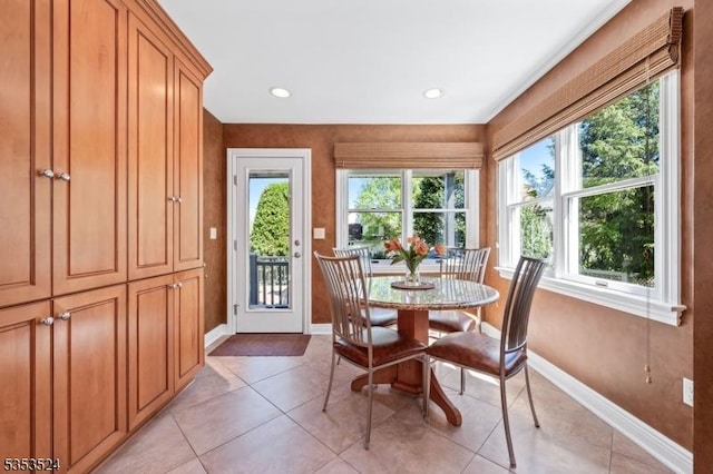 dining room featuring baseboards, recessed lighting, and light tile patterned flooring