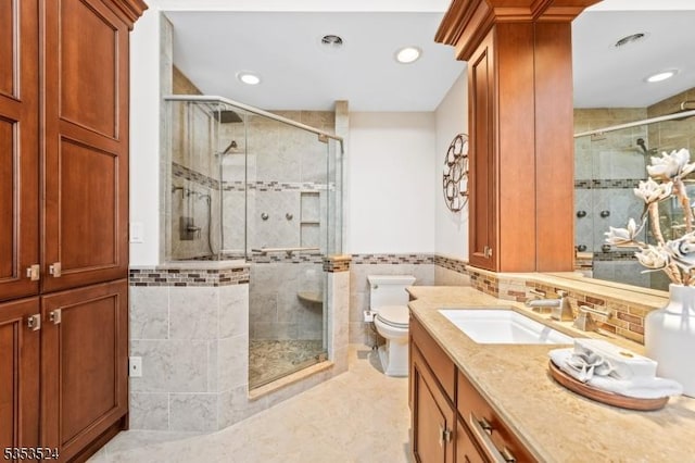 full bath featuring recessed lighting, toilet, tile walls, and a shower stall
