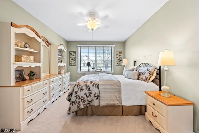 bedroom with ceiling fan and light colored carpet