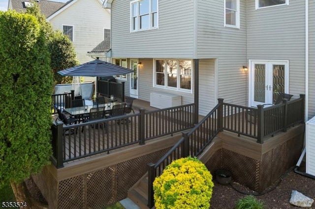 deck with french doors, stairway, and outdoor dining space