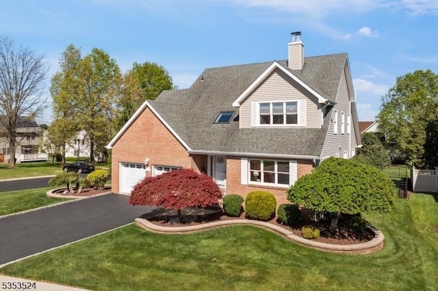 view of front facade featuring driveway, a chimney, brick siding, a front lawn, and an attached garage
