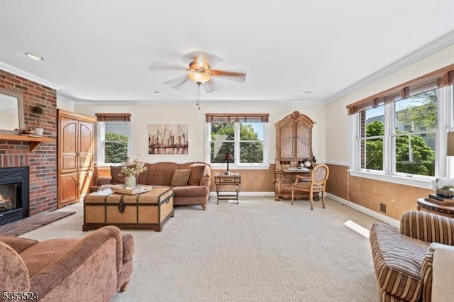 living room featuring light colored carpet, plenty of natural light, a fireplace, and ceiling fan