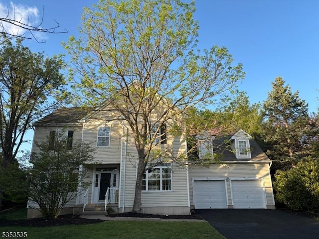 view of front of property with aphalt driveway