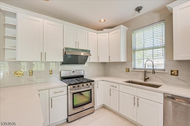 kitchen featuring a sink, open shelves, appliances with stainless steel finishes, and white cabinetry