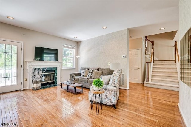 35 Hansom Rd, Bernards Twp, NJ 07920 - living area featuring a premium fireplace, recessed lighting, baseboards, wood finished floors, and stairway