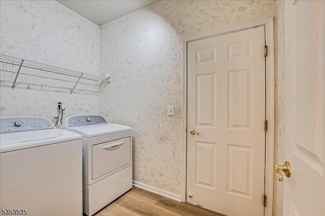 35 Hansom Rd, Bernards Twp, NJ 07920 - washroom with laundry area, baseboards, wallpapered walls, light wood-type flooring, and separate washer and dryer
