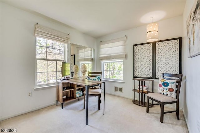 home office with carpet flooring, baseboards, and visible vents