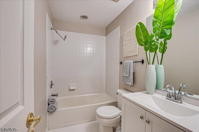 bathroom with vanity, toilet, and shower / tub combination
