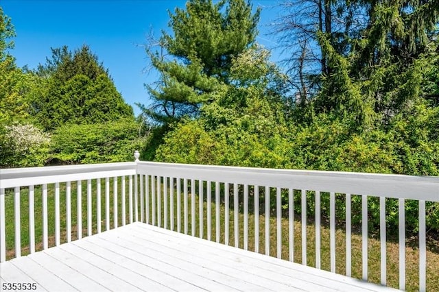 wooden terrace with a yard