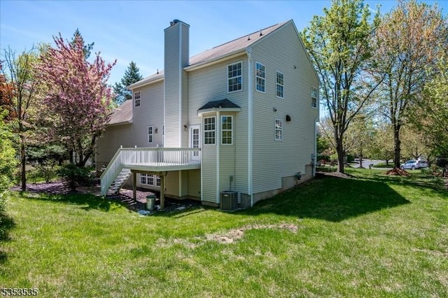 35 Hansom Rd, Bernards Twp, NJ 07920 - rear view of house featuring central AC, a deck, a chimney, stairs, and a lawn