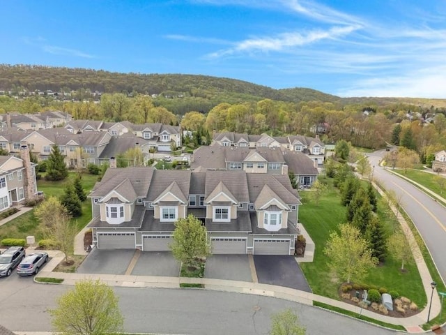 bird's eye view with a forest view and a residential view