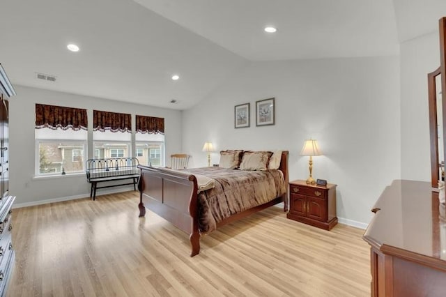 bedroom with visible vents, light wood-style flooring, recessed lighting, baseboards, and vaulted ceiling