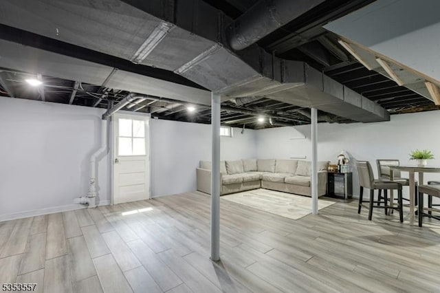 basement featuring wood finished floors