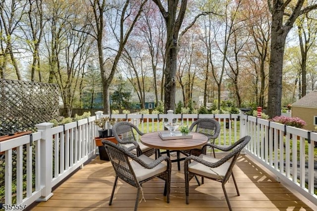 deck with outdoor dining area