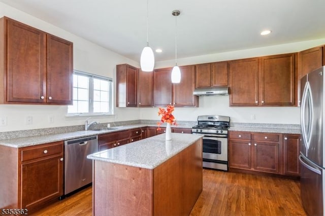 23 Schenck Ln, Franklin Twp, NJ 08873 - kitchen with recessed lighting, stainless steel appliances, under cabinet range hood, a kitchen island, and dark wood-style flooring