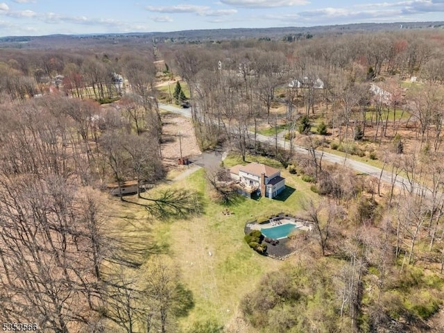 drone / aerial view with a view of trees