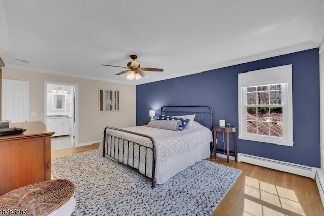 bedroom with baseboards, visible vents, light wood-style flooring, and crown molding