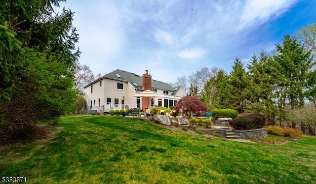 2 Natale Dr, Sparta Twp, NJ 07871 - rear view of property with a yard and a chimney