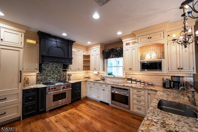 2 Natale Dr, Sparta Twp, NJ 07871 - kitchen featuring backsplash, appliances with stainless steel finishes, a sink, and light stone counters