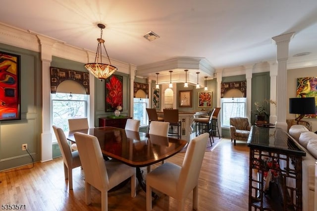 2 Natale Dr, Sparta Twp, NJ 07871 - dining area featuring a healthy amount of sunlight, ornate columns, wood finished floors, and visible vents
