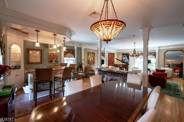 2 Natale Dr, Sparta Twp, NJ 07871 - dining area with crown molding, a notable chandelier, decorative columns, wood finished floors, and visible vents