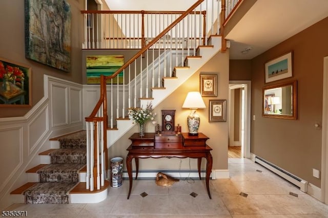 2 Natale Dr, Sparta Twp, NJ 07871 - stairs with tile patterned floors, baseboards, a high ceiling, and a baseboard radiator
