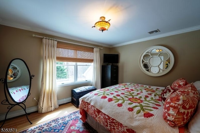 2 Natale Dr, Sparta Twp, NJ 07871 - bedroom featuring crown molding, visible vents, baseboard heating, and light wood finished floors