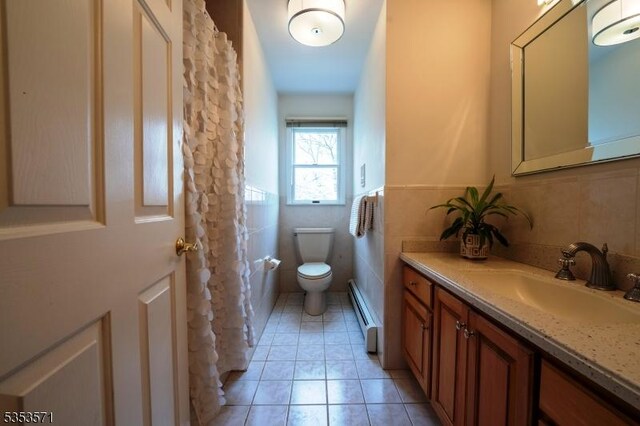 2 Natale Dr, Sparta Twp, NJ 07871 - bathroom featuring tile walls, baseboard heating, tile patterned floors, vanity, and toilet